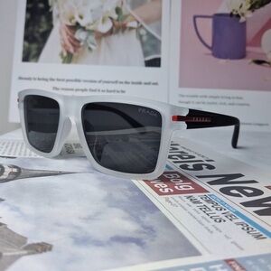 Prada Men’s White Frame Black Lens Sunglasses with Red Accent